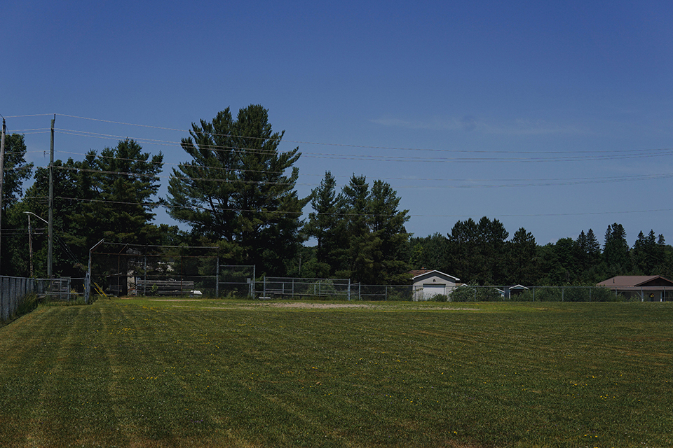 Rosseau Ball Diamond and trees in summer